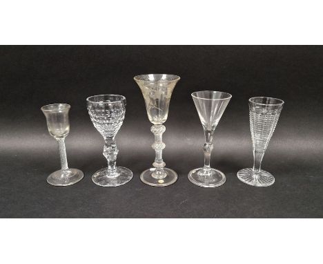 Group of five mid-18th and later drinking glasses, the first with flared bowl engraved with fruiting vine above double knoppe