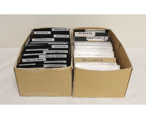 Two boxes of vintage and antique postcards depicting railways and regional subjects.