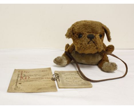An Unusual Steiff straw filled mohair dog soft toy, possibly a pug, with button ear and leather collar and lead stamped Stief