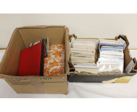 Two boxes of vintage and antique postcards mostly of landscapes and cityscapes.