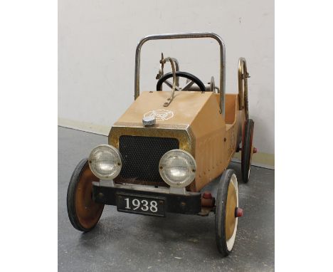 Child's ride-in pedal car in the style of an old fire engine with licence registration "FD1938" with winch fitted to the back