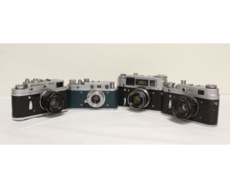 Four vintage Russian film cameras to include Zorki 4K with a Helios Jupiter 50mm F2 lens and a Fed 3 camera with a similar le