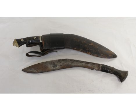 Two Antique Nepalese Kukris, one in curved leather scabbard with two smaller blades, inlaid handles and lion head pommel. The