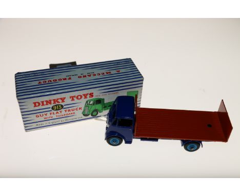 Dinky Toys diecast commercial model vehicle 913 Guy Flat Truck with Tailboard with blue cab, orange flatbed and light blue hu