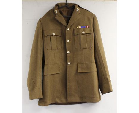 British Army dress uniform jacket having staybrite buttons by Firmin, grenade collar badges, lower sleeve cloth trade badge w