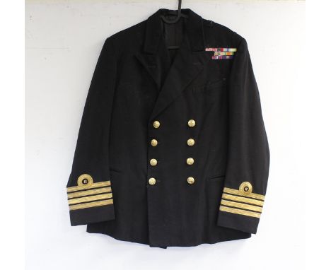 British Royal Navy dress uniform jacket having Gieves label, brass naval buttons by Gieves, bullion wire cuff ring insignia f