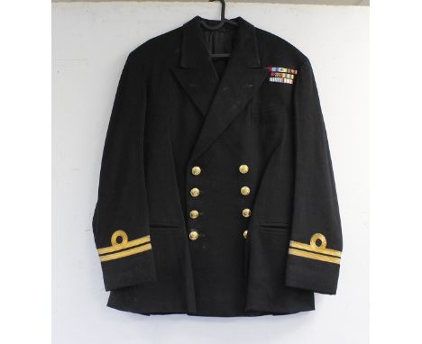 British Royal Navy dress uniform jacket having Baker and Co of Devonport label "D R P Pugh RN Sept 5.59", brass naval buttons