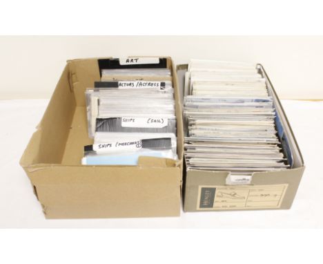 Two boxes of vintage and antique postcards.