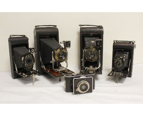 Five antique folding plate cameras to include two Eastman Kodak No. 3-A folding pocket Kodak model B-4, one circa 1909 and an