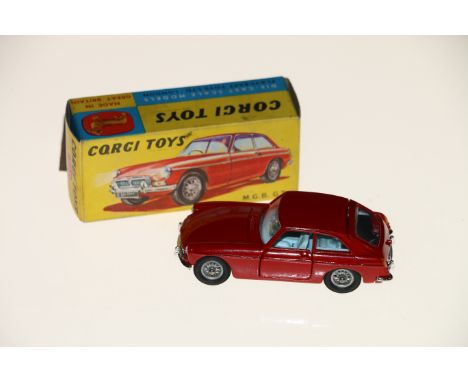 Corgi Toys diecast model vehicle 327 MGB GT with red body, light blue interior, spoked wheels and black suitcase, boxed, (1) 