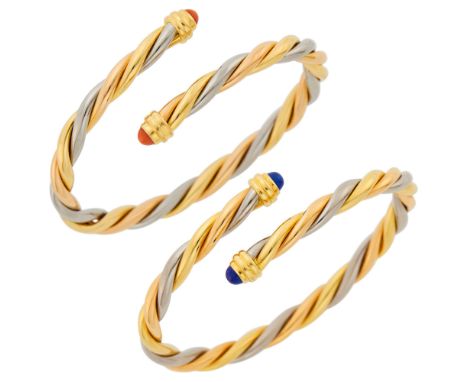 18 kt. yellow, white and rose gold, 2 round cabochon lapis ap. 4.5 mm., 2 round cabochon coral ap. 4.5 mm., signed Cartier, 1