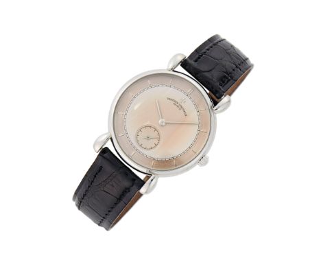 Mechanical, round silver and rose-tone dial, silver-tone bar markers applied on outer rose-tone rim, subsidiary seconds, minu