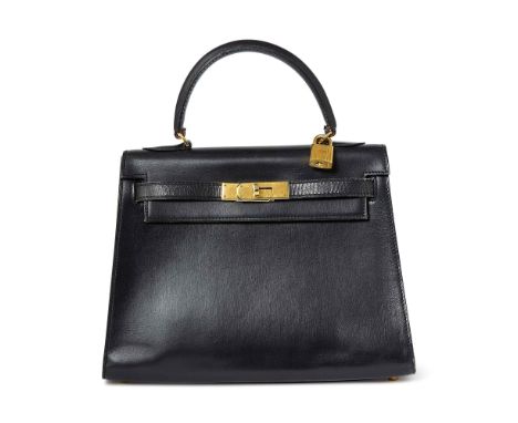 Top handle bag with gold-tone hardware and turn-lock closure, lock, keys and clochette, black leather interior with one side 