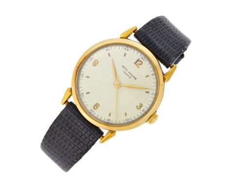 18 kt., mechanical, circular silver-tone dial with gold Arabic numerals at the quarter hour and bar markers, sweep seconds, m