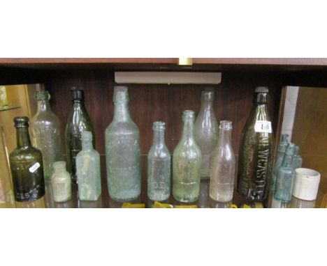 Shelf of antique glass bottles