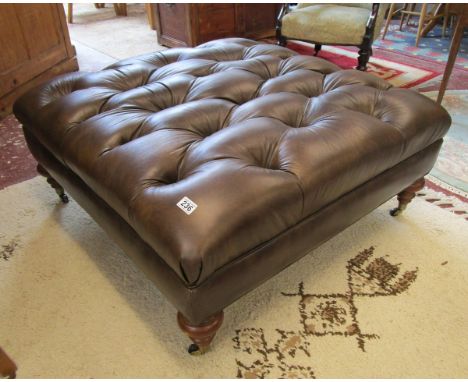 Very large leather pouffe on legs