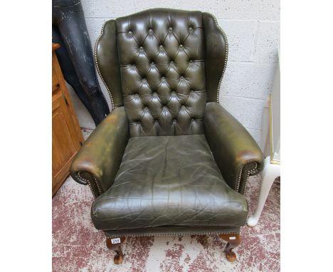 Button-back leather armchair
