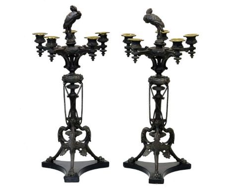 Pair of French cast spelter five-light table candelabra, each modelled with a central perching bird in the manner of Auguste 