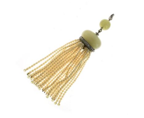 Jade, diamond and seed pearl tassel pendant, circa 1920, the jade bead with a diamond suspension above, also below to a large