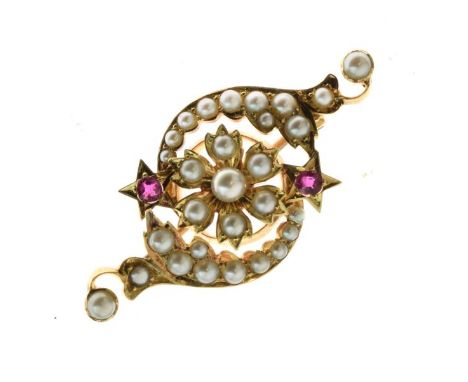 Edwardian seed pearl brooch, unmarked, the flowerhead centre with curled lines above and below with two ruby set star motifs,