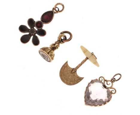 Victorian engraved yellow metal charm in the form of a kitchen spice chopper, a Georgian flowerhead pendant set garnets, a ye