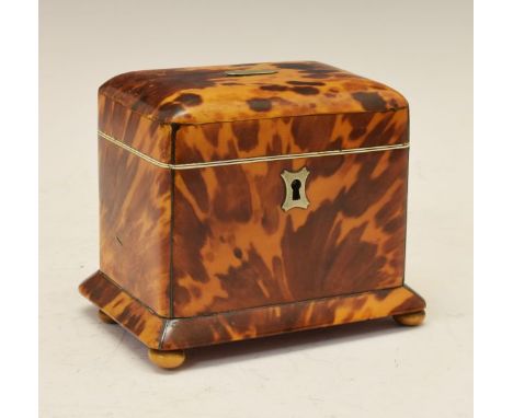 19th Century tortoiseshell tea caddy of rectangular form, the hinged cover opening to reveal a secondary cover, standing on f