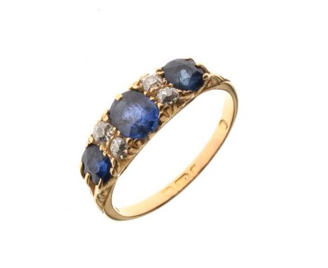 Sapphire and diamond 18ct gold ring, circa 1910, the three graduated oval cut stones with pairs of old cut diamonds between, 