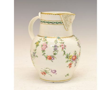 Rare Champions Bristol porcelain jug, circa 1780, polychrome decorated with floral swags, gilt highlights and moulded maskhea