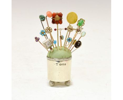 Collection of eighteen stickpins, in various metals and stone set, including a French gold coin; a fly stickpin' a split pear