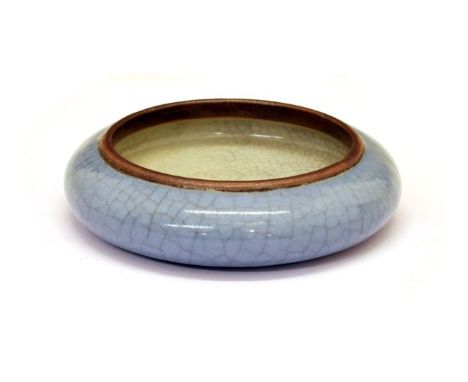 Small Chinese pale blue crackle glazed dish, the underside with Daoguang four character mark, 8cm diameter  Condition: One mi