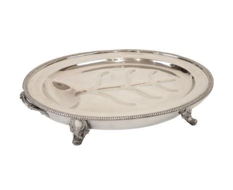 Late 19th/early 20th Century silver plated warming meat dish having a gadrooned rim, two handles and standing on four scroll 