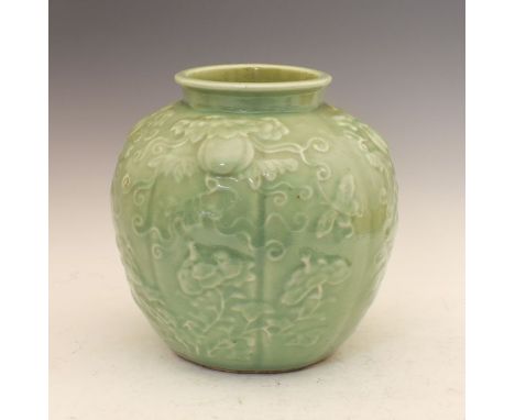 Chinese celadon glazed lobed ovoid vase decorated in relief with butterflies amongst fruiting foliage, the underside with Yon