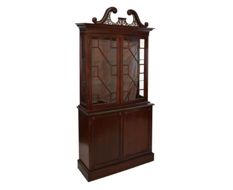 George III style mahogany two section display cabinet, in the Chippendale taste, 20th Century, the upper stage having a swan 