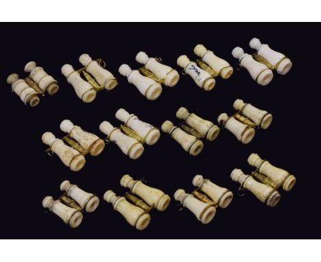 Group of thirteen 19th and early 20th Century bone miniature binoculars each with double Stanhope viewer, printed views compr