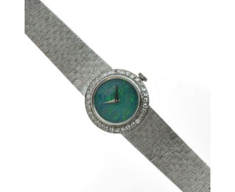 Chopard - Lady's white gold diamond and opal bracelet watch, stamped '750', the circular opal dial enclosed by a bezel set wi