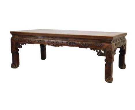 Late 19th/early 20th Century Chinese hardwood low or 'opium' table, the rectangular top above carved friezes of bats and clou