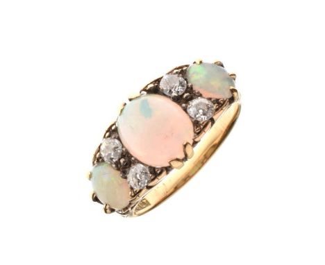 Opal and diamond ring, stamped '18ct', the three graduated oval cabochons with pairs of old brilliant cuts between, totalling