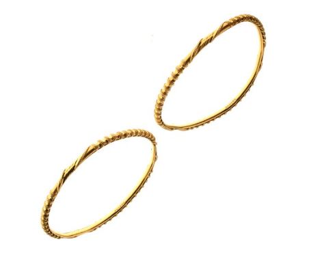 Pair of Indian bangles, stamped 'BPV22c', 3mm wide, 6.2cm internal diameter, approx 31.6g gross  Condition: One bangle out of