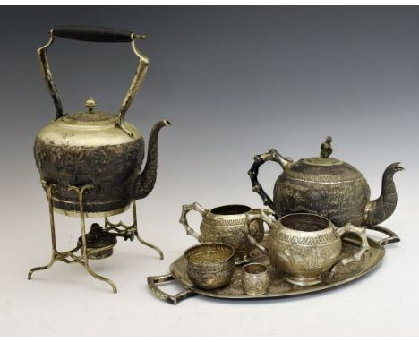 Matched late 19th Century Indian white metal tea service comprising: spirit kettle and stand 40.5cm high, teapot, two handled