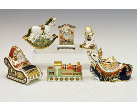 Group of Royal Crown Derby Christmas-related paperweights, comprising: Santa with sleigh and reindeer, Treasures of Childhood