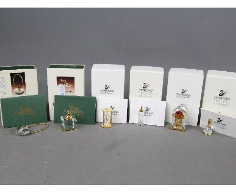 Swarovski Crystal - four Swarovski Crystal collectables to include Juke box, bell, bottle and sand timer and two Crystal Memo