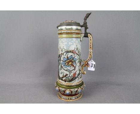 A Villeroy &amp; Boch, Mettlach stoneware stein by Christian Warth, decorated with a couple set between foliate and floral sc