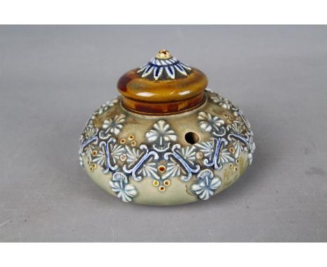 A Doulton Lambeth Stoneware inkwell of squat bulbous form, relief decorated with stylised motifs, impressed marks to the base