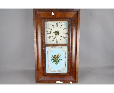 An American Ogee-styled 30-hour weight-driven wall clock, polished mahogany veneer to the case, square painted dial and rever