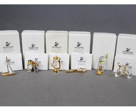 Swarovski Crystal - six Swarovski Crystal collectables to include binoculars, lamp, tricycle, a vintage mobile phone, a tenni