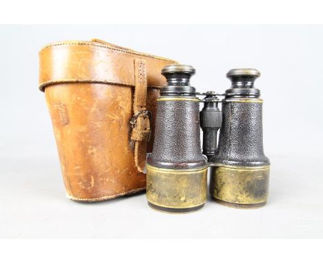 A pair of early 20th century binoculars Ross, London, stamped with Broad Arrow / crows foot, contained in leather case.