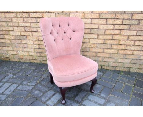 A button back nursing chair, dusky pink upholstery