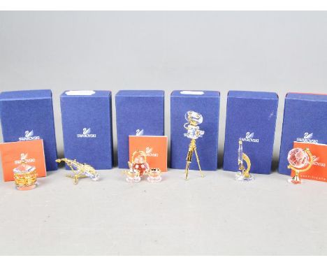 Swarovski Crystal - six Swarovski Crystal collectables to include a carousel, tea pot and two coffee cups, a vintage video ca