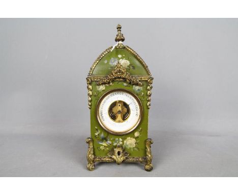 An interesting early 20th century mantel aneroid barometer, open dial mechanism, the metal case having hand-painted floral de