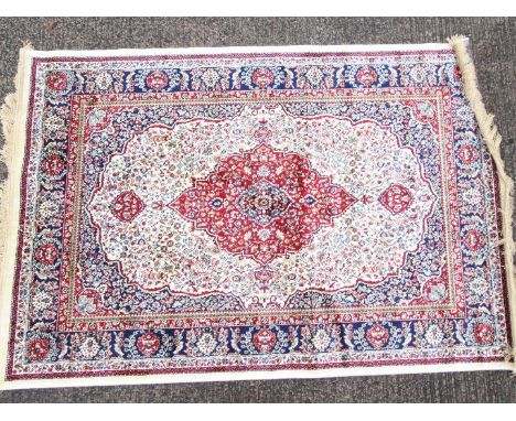 An ivory ground Kashmir carpet / rug, approximately 170 cm x 120 cm. Est £100 - £150